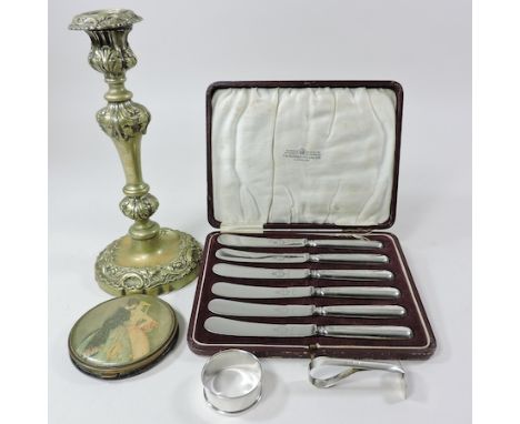 A set of early 20th century silver handled tea knives, cased, together with a plated candlestick, silver pusher, napkin ring 