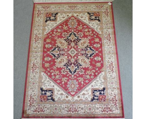 A Ziegler carpet, with a central medallion, on a red field, 230 x 160cm