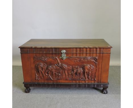An Indian carved trunk, decorated with elephants, 115cm 