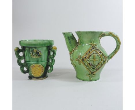 A 19th century Castle Hedingham green glazed pottery jug, relief decorated with a diamond, inset with a portrait medallion, i