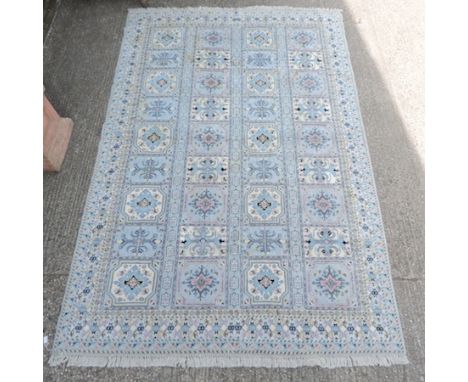 A Moroccan woollen carpet, on a blue ground 