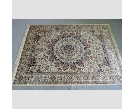 A Keshan carpet, on a cream ground, 280 x 200cm 