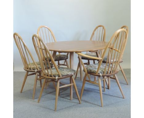 A 1970's Ercol light elm drop leaf dining table, 114 x 120cm, together with a set of six spindle back dining chairs