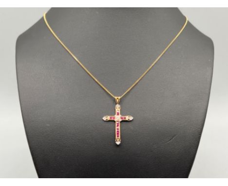 Ladies 9ct gold ruby and diamond cross pendant and chain. 2.7g