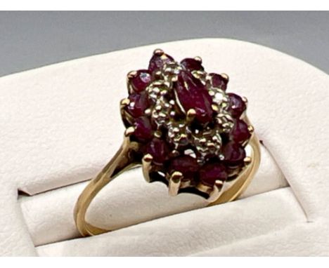 Ladies gold rudy stone cluster ring. Featuring 13 ruby stones. 2.1g size O