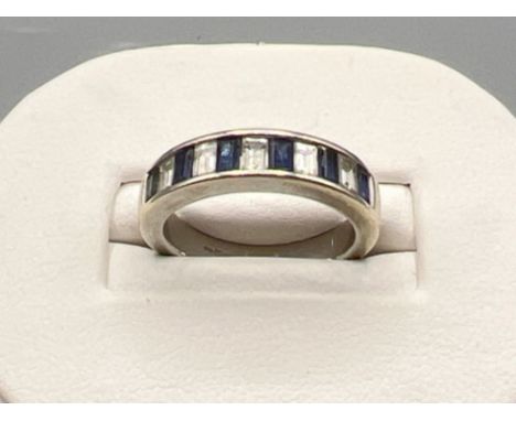 Ladies 9ct white gold sapphire and diamond band. Comprising of 6 baguette cut sapphires and 5 baguette cut diamonds. Size K 4