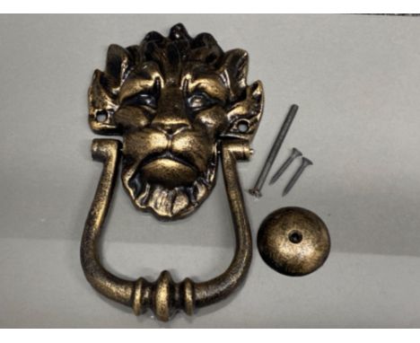 A reproduction cast metal 10 Downing Street knocker in the form of a lion