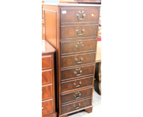 A mahogany four drawer narrow filing cabinet, 139cm high.