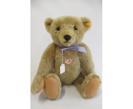 A large Steiff 1906 replica teddy bear, with felt pads, chest label, ear button and tag, 53cm long (Est. plus 21% premium inc