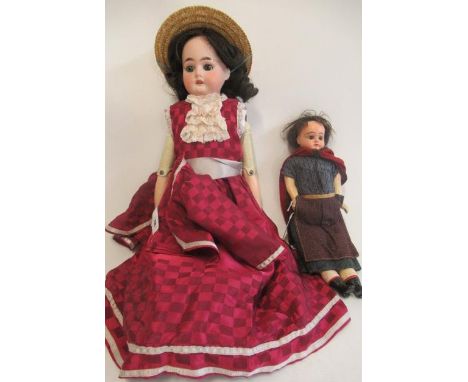 Two antique dolls, comprising an Armand Marseille bisque shoulder head, with blue glass sleeping eyes, open mouth, teeth, com