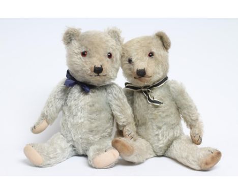 A rare pair of Chiltern blue teddy bears, both with blue plush, amber eyes, sewn noses and cloth pads, both 20" long (Est. pl