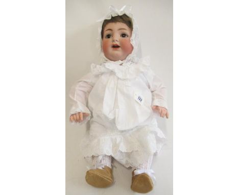A Kammer & Reinhardt Simon Halbig bisque socket head character doll, with brown glass sleeping eyes, open mouth, teeth, tremb