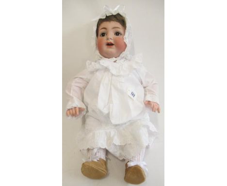 A Kammer & Reinhardt Simon Halbig bisque socket head character doll, with brown glass sleeping eyes, open mouth, teeth, tremb