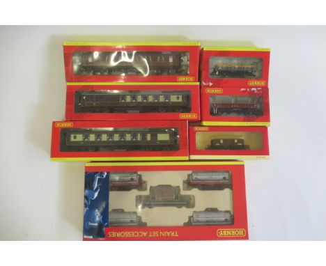 Hornby rolling stock comprising tank wagon set, three goods trucks, two Pullman coaches and B.R. first class coach, boxed, E-