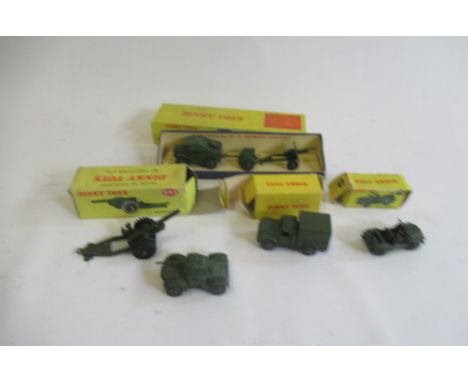 Dinky army vehicles comprising 674 Austin Champ, 641 Cargo Truck, 697 Field Gun Set, 693 Howitzer and Armoured cars, boxes F-