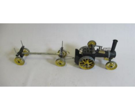 A Mamod steam traction engine and log wagon finished in black and yellow, with burner, F-G (Est. plus 21% premium inc. VAT)