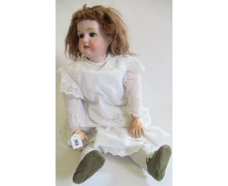 A large Armand Marseille bisque socket head doll, c.1880, with blue glass sleeping eyes, open mouth, teeth, light brown wig, 