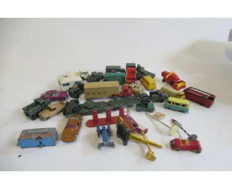 Playworn Matchbox vehicles including tractor, army trucks and petrol pumps, some items damaged or over painted, F-P (Est. plu