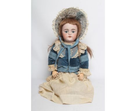 A Simon & Halbig bisque socket head doll, with blue glass fixed eyes, open mouth, moulded teeth, pierced ears, light brown wi