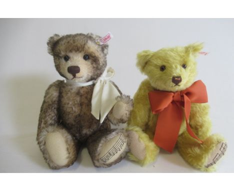 Two Steiff musical bears, comprising a 30cm English bear, and a 29cm blond bear (Est. plus 21% premium inc. VAT)Good