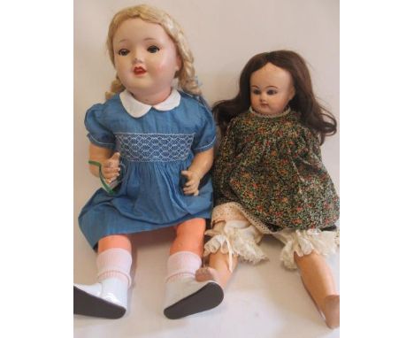 Two dolls, comprising a Sonneburg Polizenfabrik 1930s socket head, with blue glass sleeping eyes, open mouth, original blond 