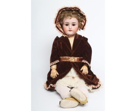 A Simon & Halbig bisque socket head doll, with brown glass sleeping eyes, open mouth, teeth, pierced ears, light brown wig, w