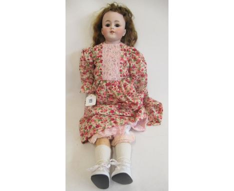 A Simon & Halbig bisque shoulder head doll, with brown glass sleeping eyes, open mouth, teeth, pierced ears, light brown wig,