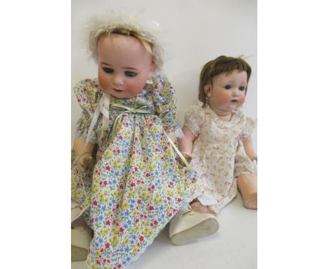 Two bisque socket head character dolls, comprising one 24" Heubach Koppelsdorf 300 7, with blue glass sleeping eyes, open mou