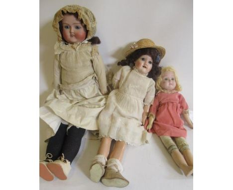 Three English bisque shoulder head dolls, comprising one L.G.Speight "CLASSIC" 905, with blue glass eyes, open mouth, brown w