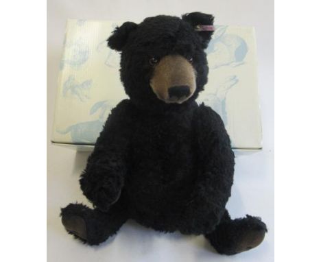 A boxed Steiff Winnipeg bear, in black and seated, 46cm (Est. plus 21% premium inc. VAT)Good