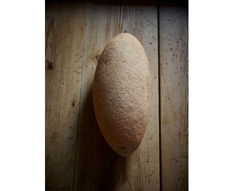  HUGE AFRICAN NEOLITHIC STONE PESTLE CENTRAL SAHARA, C. 4TH – 3RD MILLENNIUM B.C. worked stone, of elliptical form, with sand