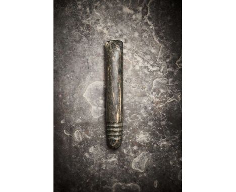  AFRICAN NEOLITHIC STONE CHOPPER TENERIAN CULTURE, CENTRAL SAHARA, C. 4TH – 2ND MILLENNIUM B.C. carved black stone, long cyli
