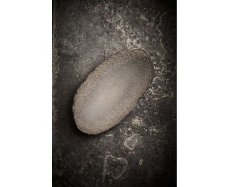  AFRICAN NEOLITHIC GRINDING STONE CENTRAL SAHARA, C. 4TH – 3RD MILLENNIUM B.C. carved volcanic stone, worked into a deep cres