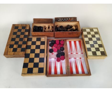 A selection of chess sets and and boards plus various vintage board games