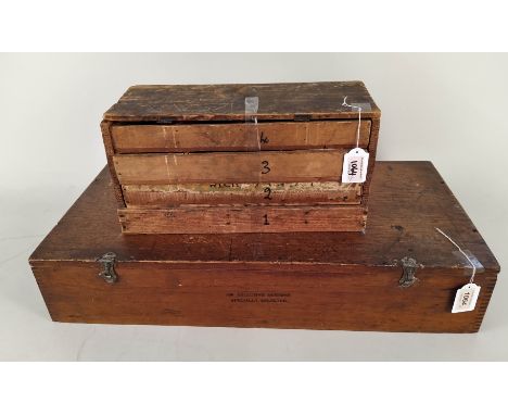 Various Meccano accessories, loose and in tins housed in a converted vintage cigar trunk, American made plus a shed work four