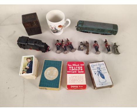 A Tucks 'Zag-Zaw' picture puzzle, vintage playing cards and chess set, a Jouef engine plus a small selection of lead soldiers