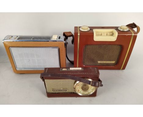 Four vintage transistor radios including a 'Sky Leader', 'Ferguson', 'Bush TR130' plus a large unmarked wood cased example