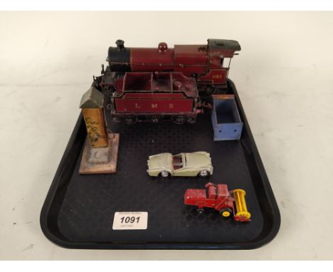 A Hornby tin plate clockwork engine and tender LMS 1185 (playworn) with mail pick up and shelter etc