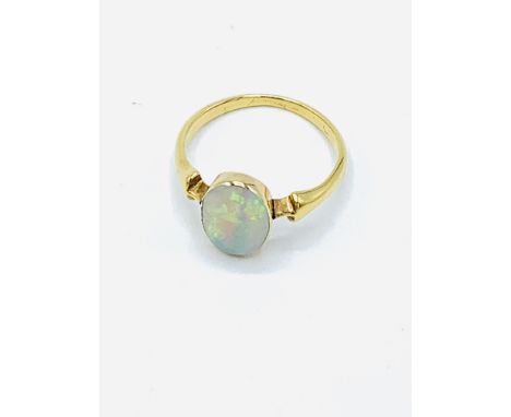 Gold set opal ring, size K, weight 2.1gms, in box. Estimate £60-80.