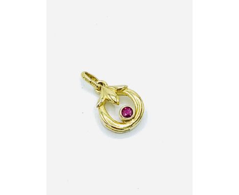 Small ruby set 9ct gold circular pendant, 18mm including bail. Weight 1.1gms.&nbsp; Estimate £25-35.