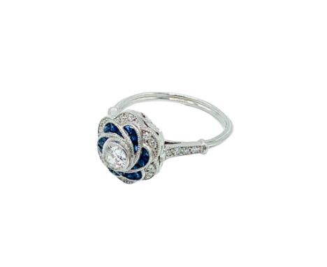 White gold, sapphire and diamond ring, centre diamond approximately .35ct, size N, weight 4.5gms. Estimate £850-1,000.
Colour