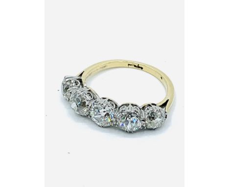 18ct gold and platinum 5 diamond half eternity ring, size L 1/2, weight 3.7gms. Diamonds combined 2.15ct, old cut. Estimate £