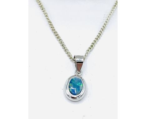 Black opal and white gold pendant and chain, Australian boulder opal doublet set in white gold rub over bezel on chain, lengt