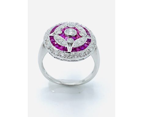 14ct white gold ruby and diamond target ring, size K, weight 3.4gms. Estimate £750-800