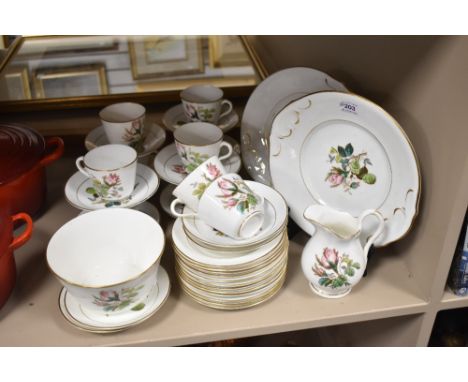 A Victorian porcelain part tea service having floral print pattern with enamel detailing