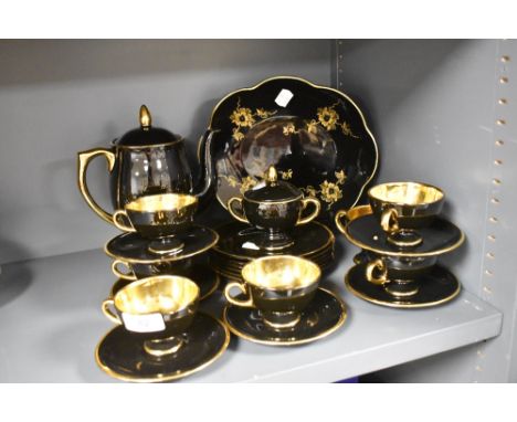 A Norsk Egersund Norway part tea service in a black and gilt glaze