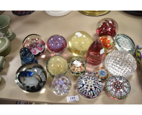 Fourteen paper weights including three Caithness, two by Wedgwood, Lamp work designs and a fine Millefiori dated 1979 etc
