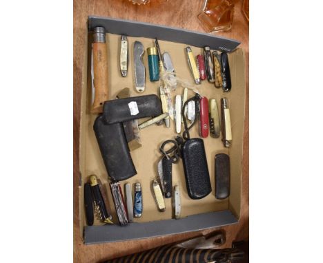 A collection of pocket and pen knives including a large Opinel, Swiss Army and Khyber.