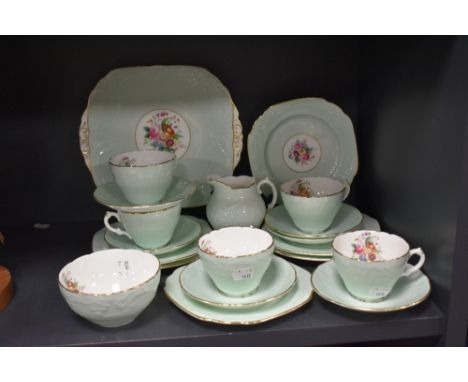 A 20th century Coalport part tea service with embossed and printed floral pattern