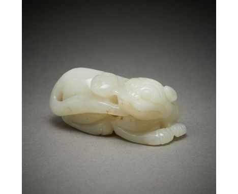 Chinese carved jade mythical beast holding a spray of lingzhi mushrooms in its mouth. Carved from a pale green jade.Height: 1